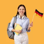 Student holding flag with German visa, ready to study abroad