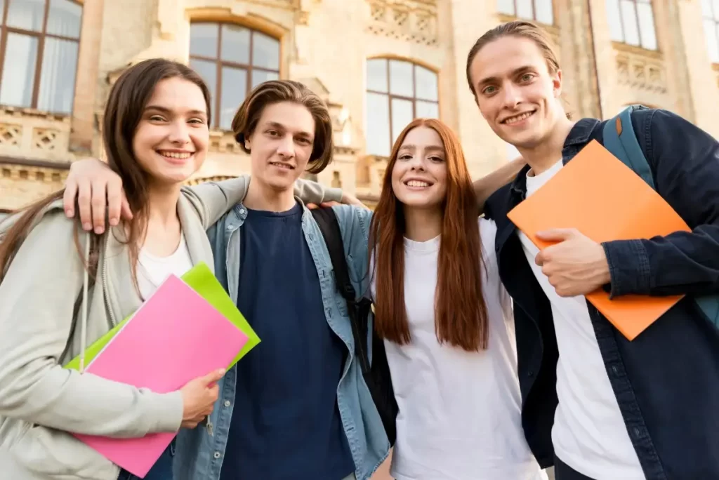 Happy students standing in front of a university – representing the top German language institute in Kerala