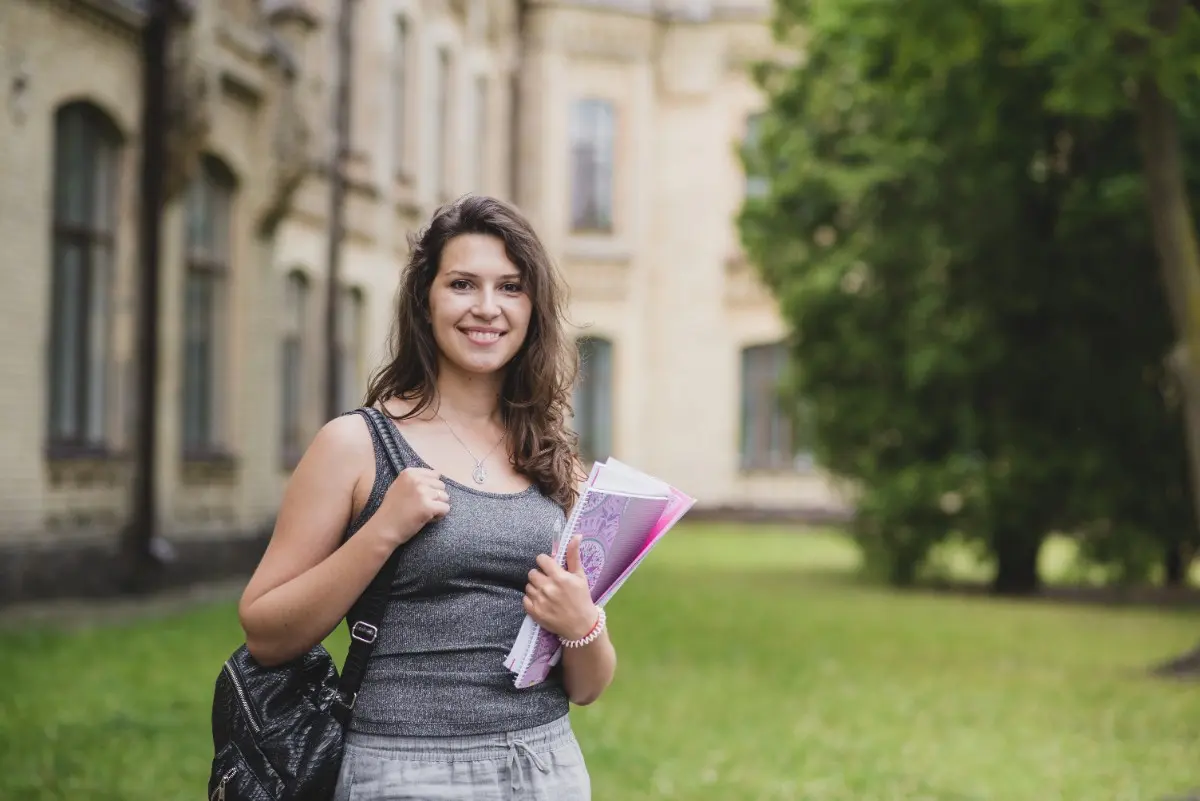 Student smiling outside campus after joining the No.1 German language institute in Cochin