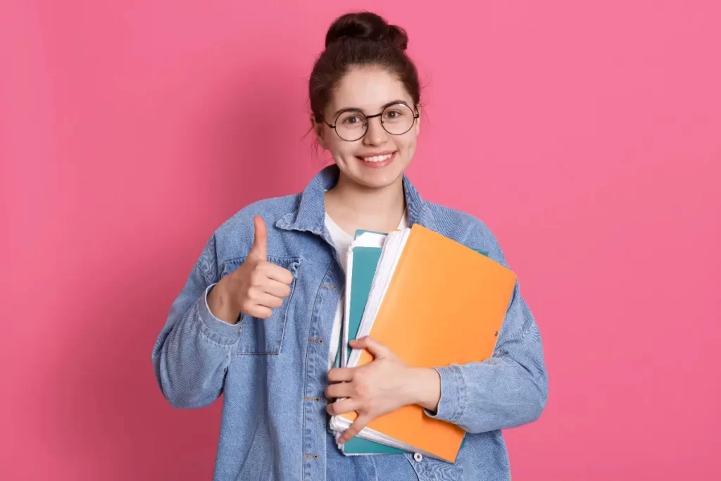 Student confidently holding study materials, representing Kerala’s best German language institute in Cochin offering expert German language training